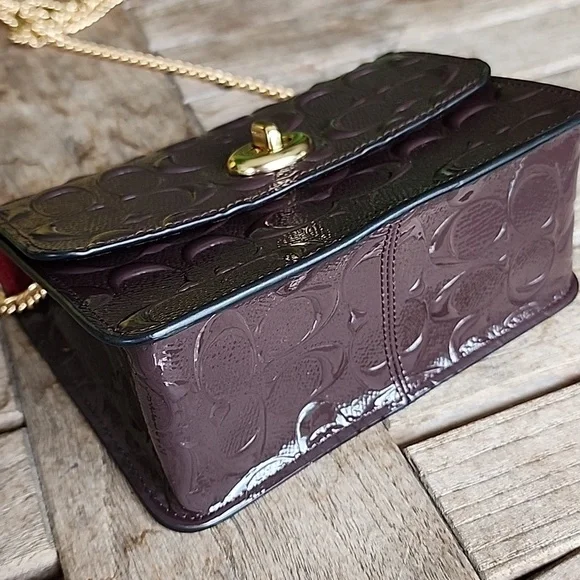 Coach Embossed Brown Crossbody Bag with Gold Chain